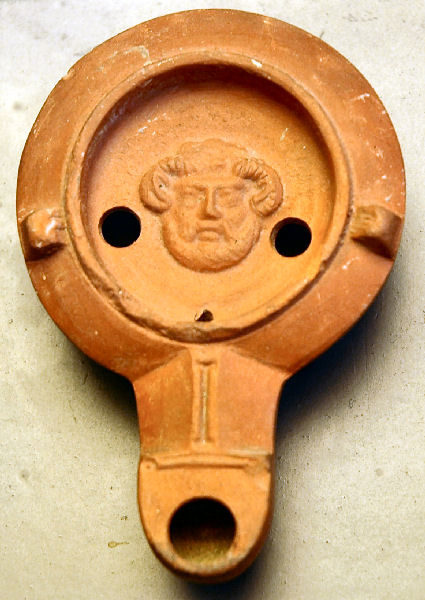 A Roman ceramic lamp with relief of the Libyan god Ammon (image courtesy of the Augsburg Roman Museum)