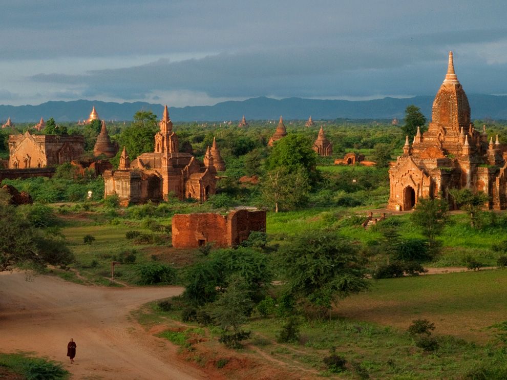 Bagan, Myanmar (Burma), a monk walks by temples (Photo courtesy of National Geographic Images)