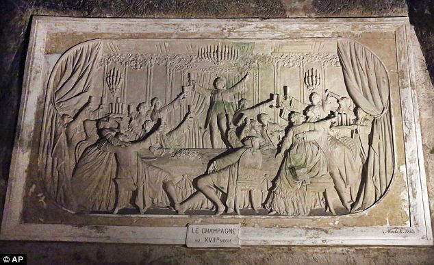 Champagne Revelers in a scene depicting 18th century. a bas-relief form 1883 at Pommery, Reims (Image in public domain)
